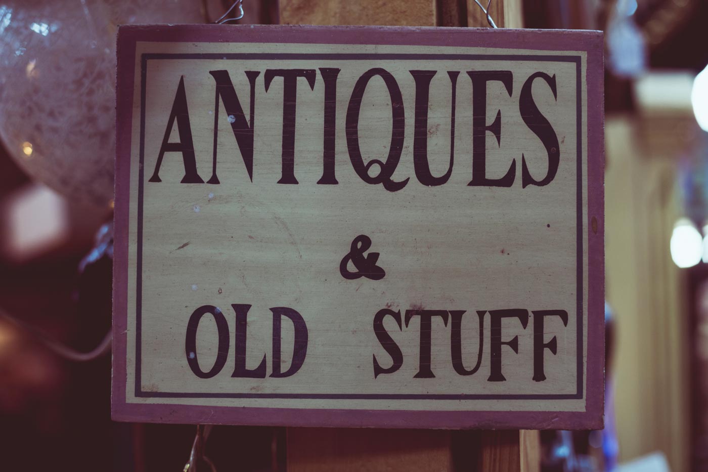 antique store sign saying antiques and old stuff