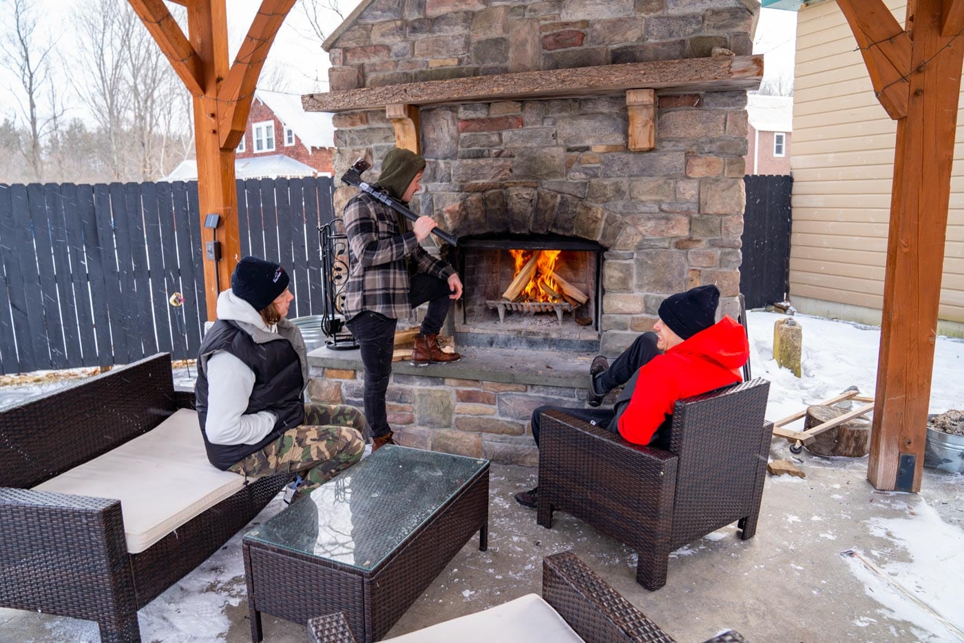 a group of people sitting around a fire place