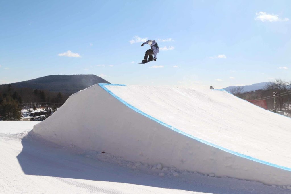a person riding skis down a snow covered slope