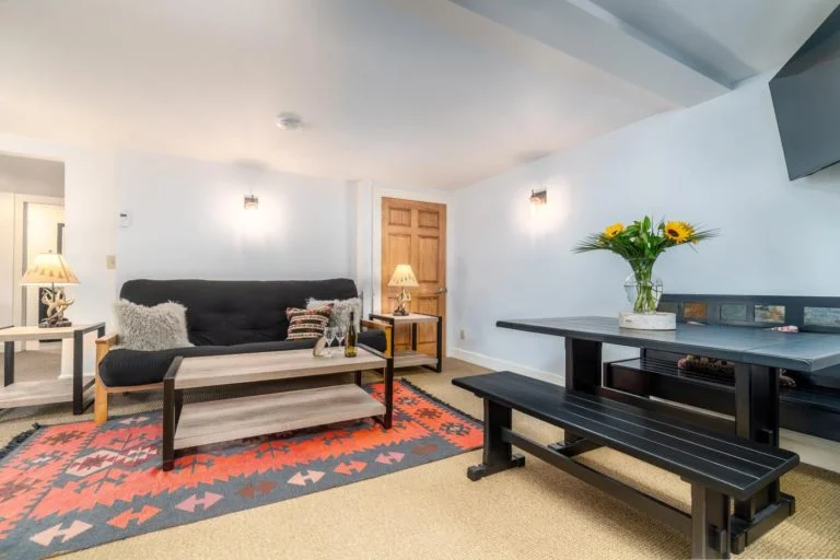 a hotel room filled with furniture and a fire place