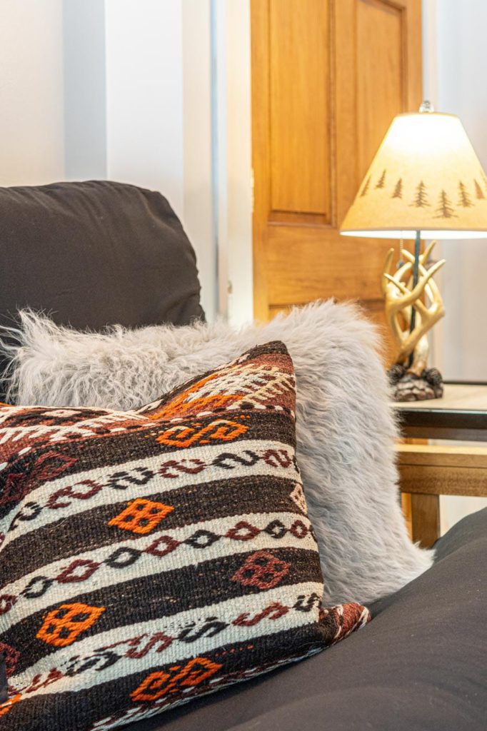a close up of a pillow on a couch