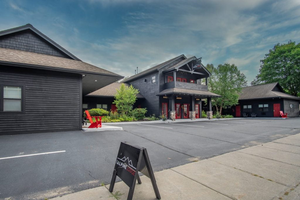 a black building with a sign in front of it